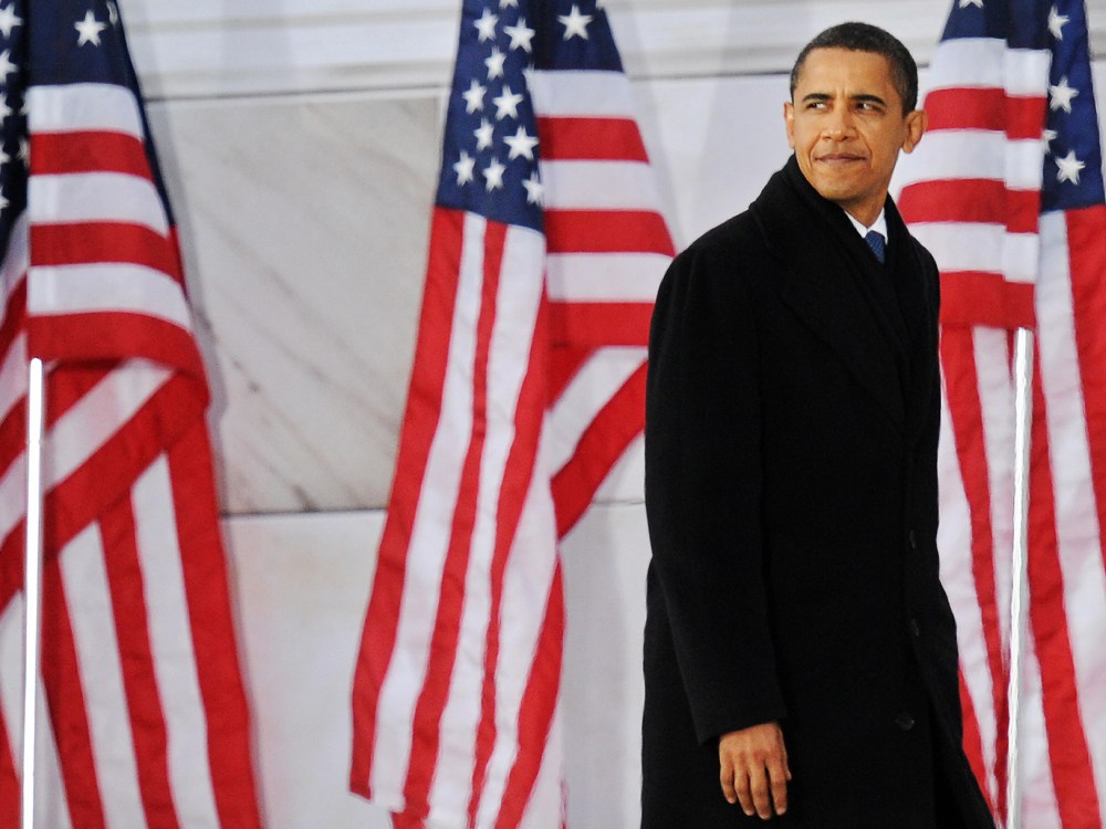 File Photo: US President-elect Barack Obama climbs up stairs to delivers his speech during the 'We Are One" concert, one of the events of Obama's inauguration celebrations, at the Lincoln Memorial in Washington on January 18, 2009. (Photo by  Jewel...