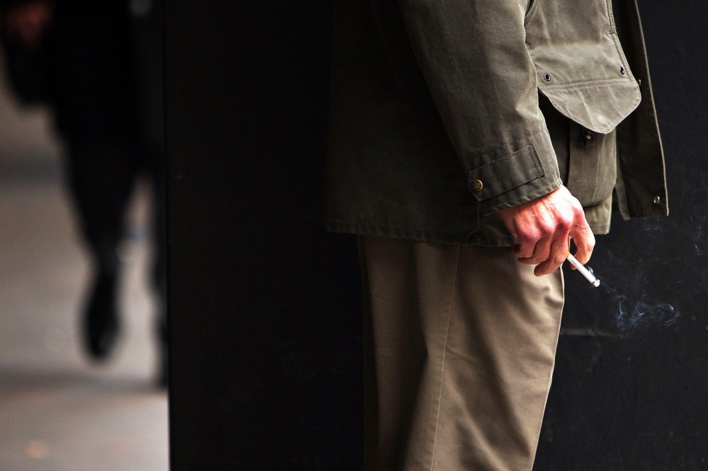 A man smokes a cigarette.