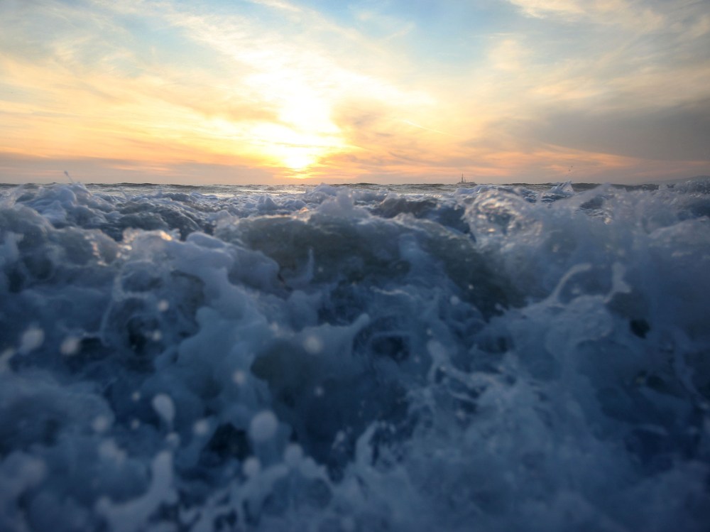 File Photo: Waves break on December 4, 2009 off Sunset Beach, California. A report released in Jan. 2013 called the California Climate Adaptation Strategy predicts that sea level rise will likely inundate many California coastal areas by 2050. (Photo...