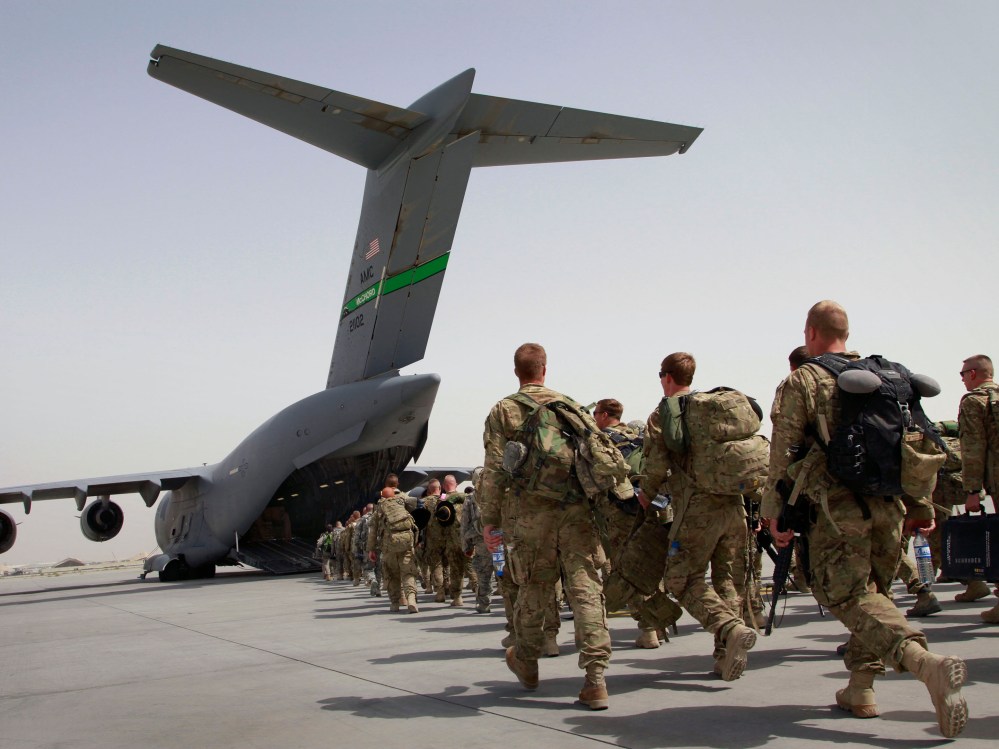 File Photo: U.S. soldiers walk to get in to a U.S. military plane, as they leave Afghanistan, at the U.S. base in Bagram, north of Kabul, Afghanistan on Thursday, July 14, 2011. (Photo by Musadeq Sadeq, AP Photo, File)