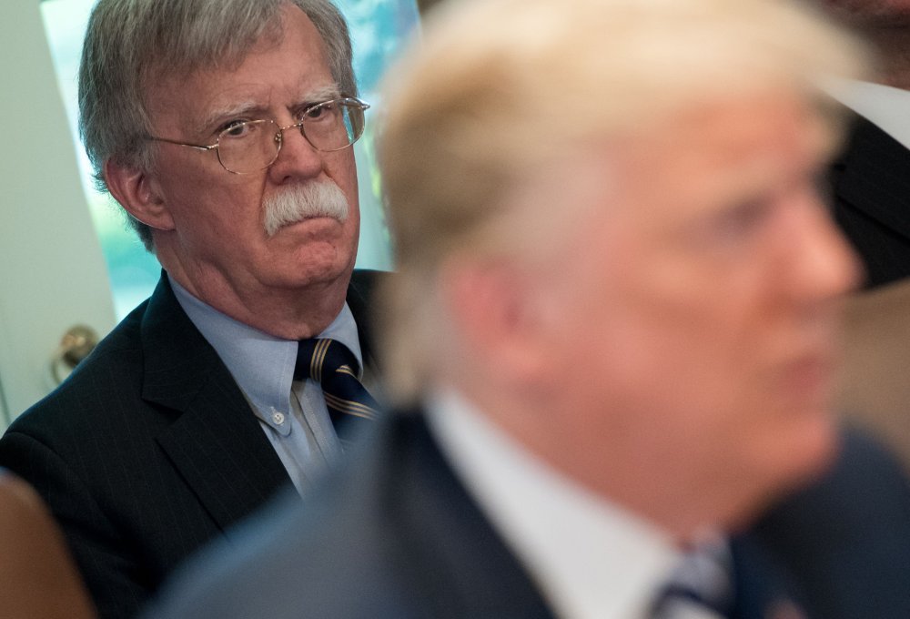 In this file photo taken on May 9, 2018, US President Donald Trump speaks alongside National Security Adviser John Bolton during a Cabinet Meeting in the Cabinet Room of the White House in Washington, D.C.
