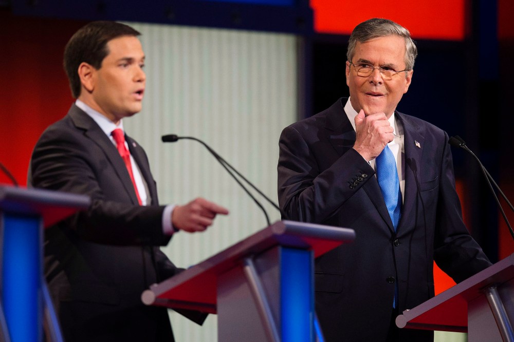 Republican Presidential candidate Florida Senator Marco Rubio speaks as former Florida Gov. Jeb Bush looks on during the debate at the Iowa Events Center in Des Moines, Iowa on Jan. 28, 2016. (Photo by Jim Watson/AFP/Getty)