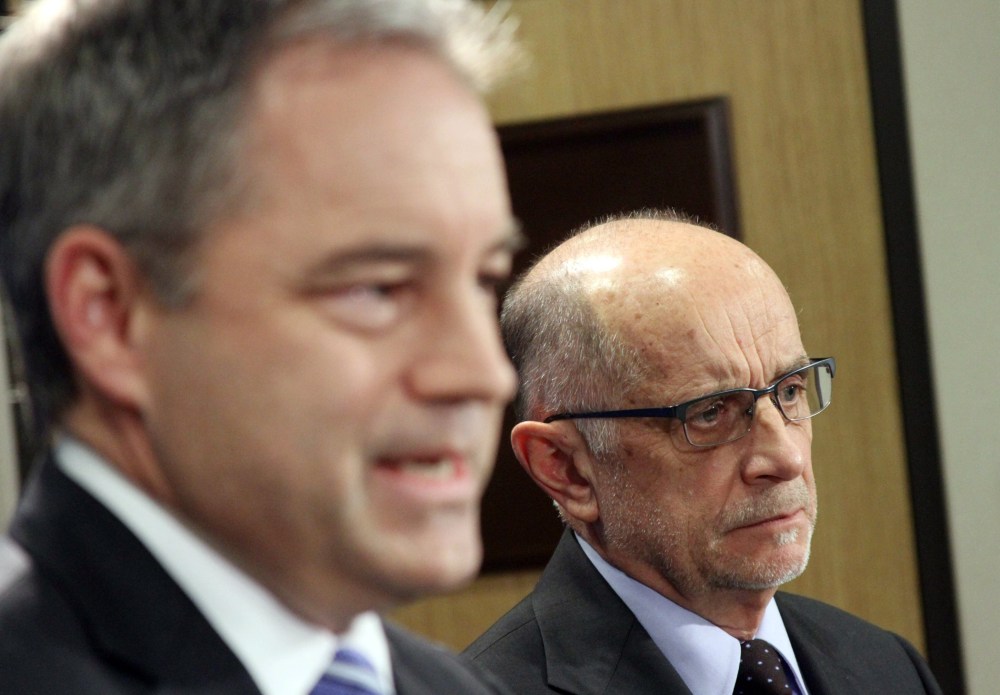 Gov. Sean Parnell, left, and Health and Human Services Commissioner William Streur appear at a news conference in Anchorage, Alaska, on Friday, Nov. 15, 2013.