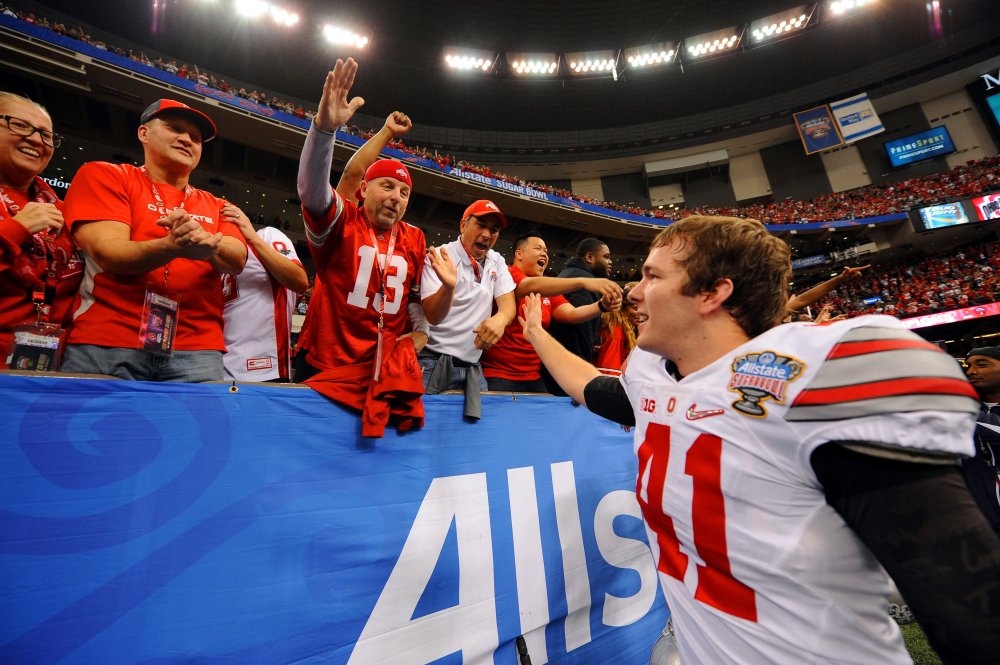 Ohio State University football fans celebrate with Buckeyes player Bryce Haynes in the 2015 College Football Playoff Semifinal at the 81st Allstate Sugar Bowl at the Mercedes-Benz Superdome in New Orleans on Jan. 1, 2015.