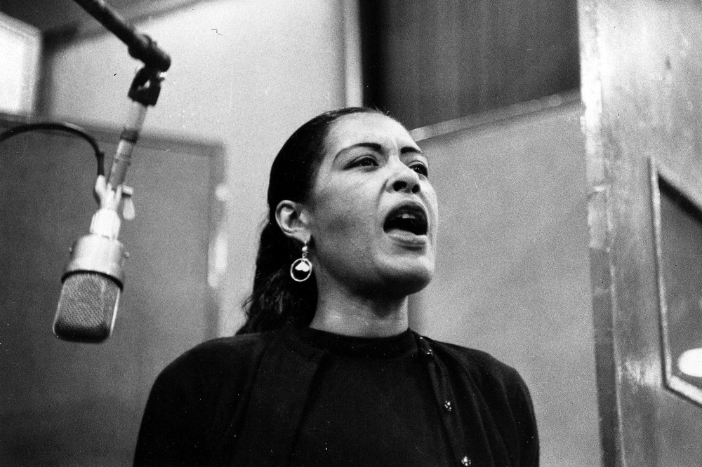 An undated photo of jazz singer Billie Holiday during a recording session.