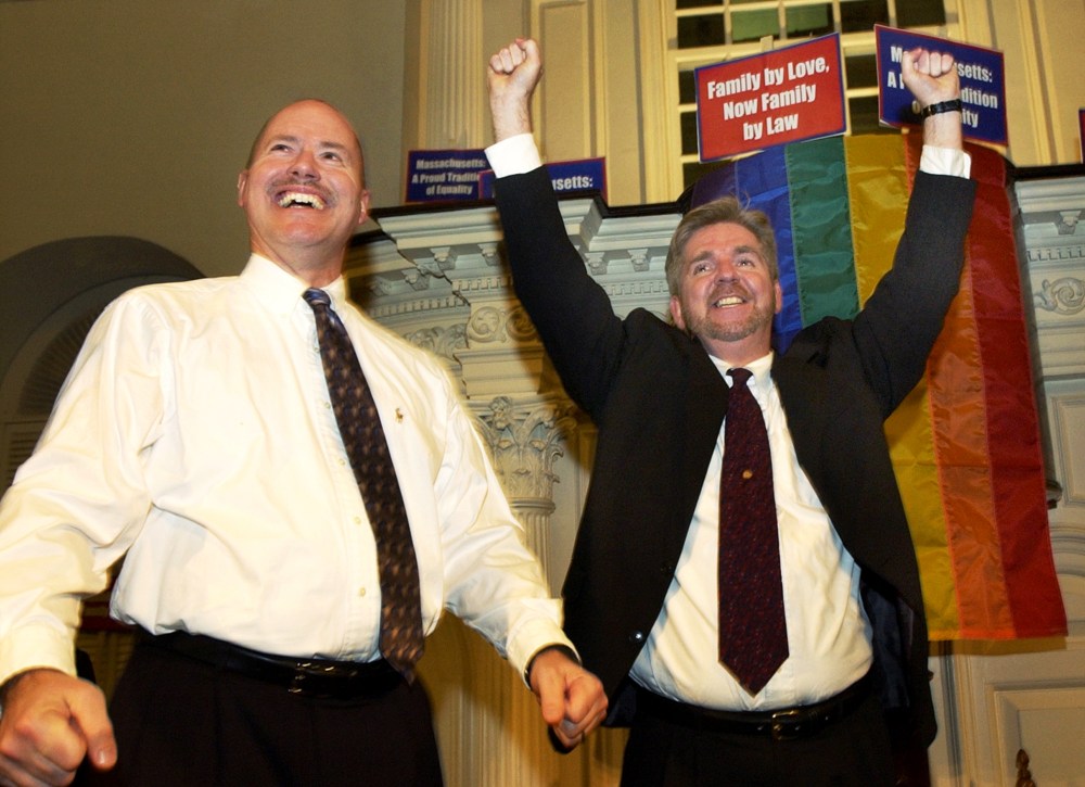 Ed Balmelli, left, and Michael Horgan of Boston, one of seven gay couples who sued the state of Massachusetts, celebrate during a rally at the Old South Meeting House in Boston on Nov. 18, 2003 after the Massachusetts Supreme Judicial Court's ruling that
