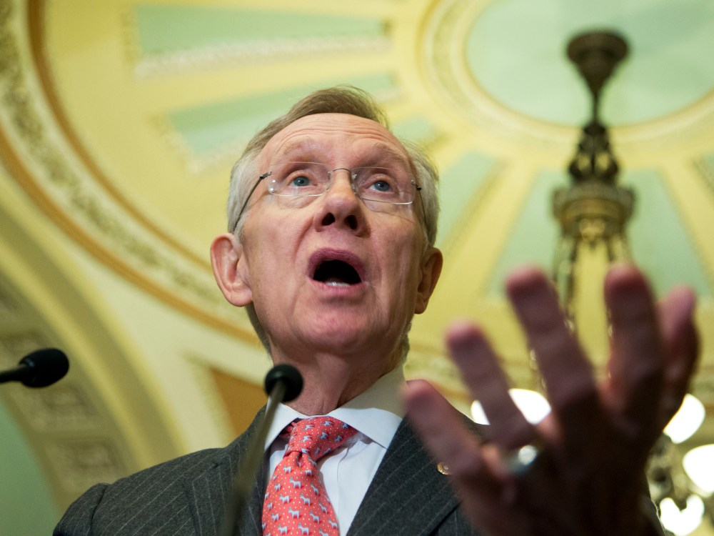 Senate Majority Leader Sen. Harry Reid of Nev gestures as he speaks to reporters on Capitol Hill in Washington. (Photo by Manuel Balce Ceneta/AP Photo)