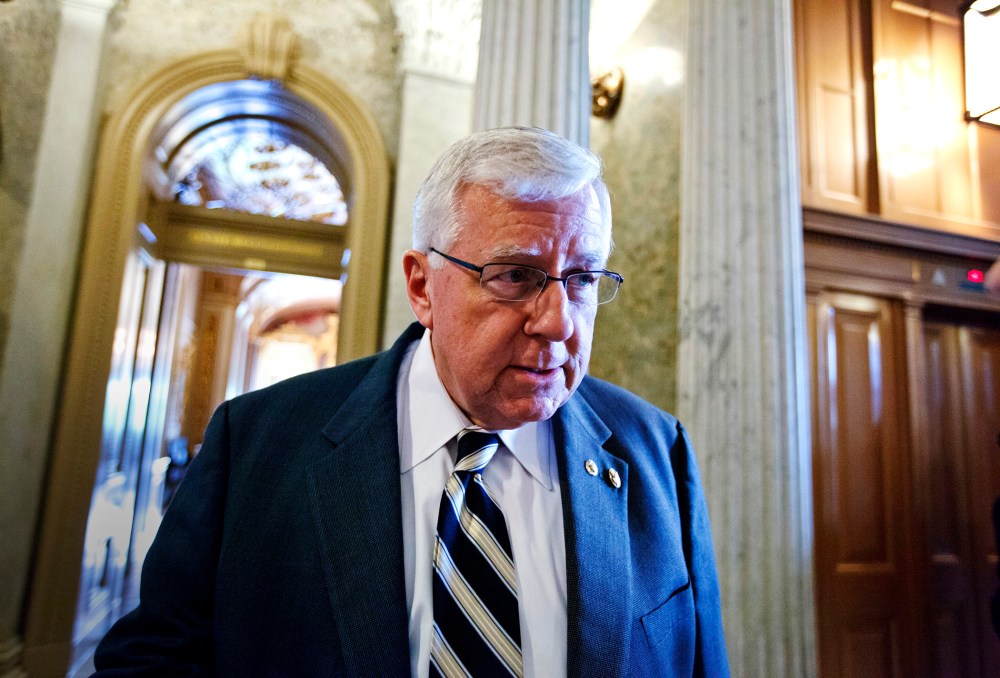 Sen. Mike Enzi pauses for questions on Capitol Hill in Washington,  May 8, 2012.