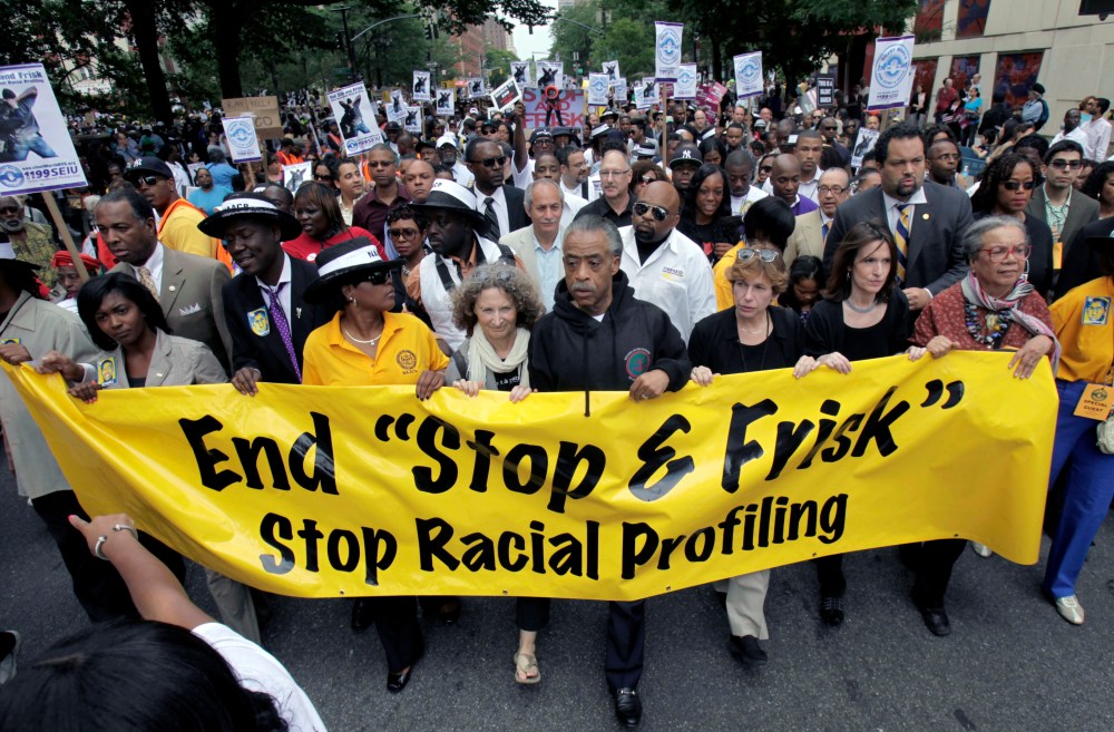 The Rev. Al Sharpton, center, walks with demonstrators during a silent march to end the "stop-and-frisk" program in New York, Sunday, June 17, 2012. Thousands of protesters from civil rights groups walked down New York Citys Fifth Avenue in total...
