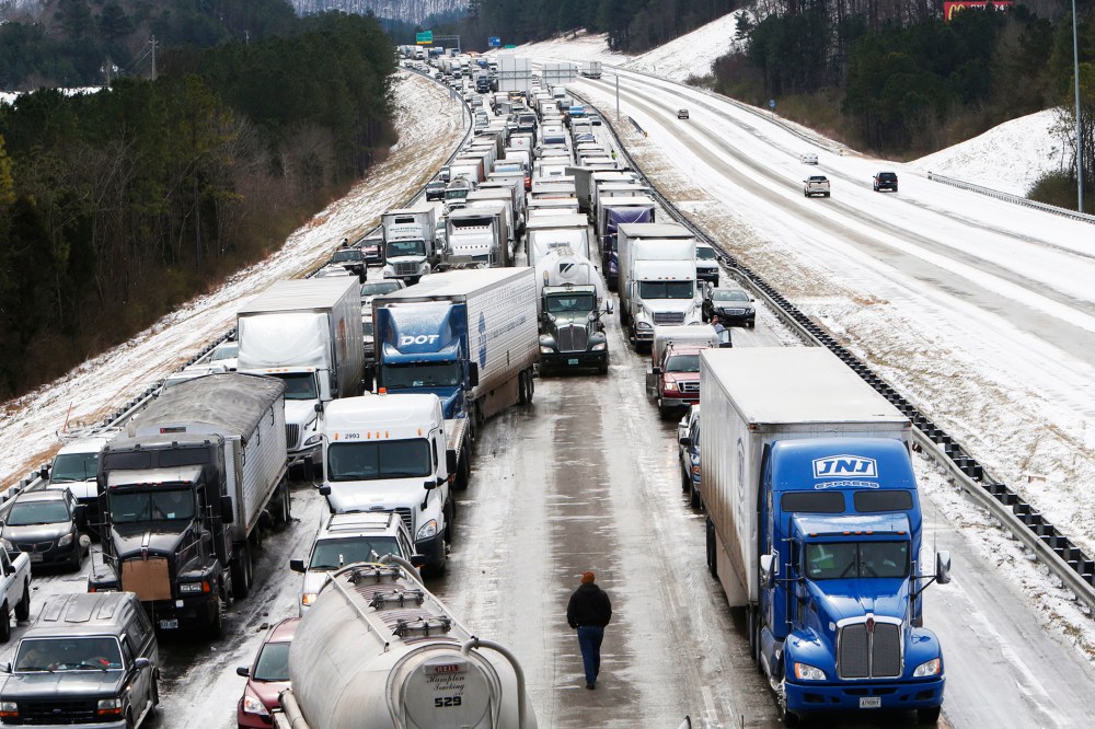 Traffic is at a standstill on Interstate 65 northbound as officials work to clear abandoned vehicles in Hoover, Ala. Jan.  29, 2014.