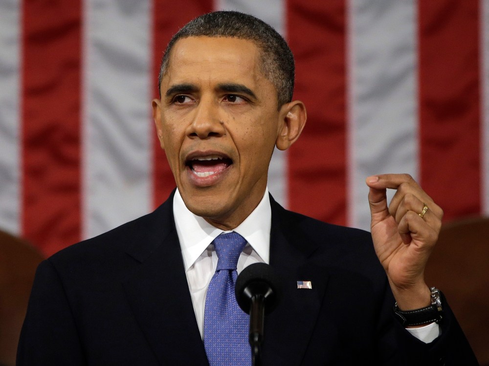 President Barack Obama gestures as he gives his State of the Union address during a joint session of Congress on Capitol Hill in Washington, Tuesday Feb. 12, 2013. (Photo by Charles Dharapak/AP)