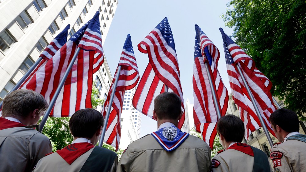 Boy Scouts from the Chief Seattle Council carry U.S. flags as they prepare to march in the Gay Pride Parade, June 30, 2013, in downtown Seattle. (Photo by Elaine Thompson/AP)
