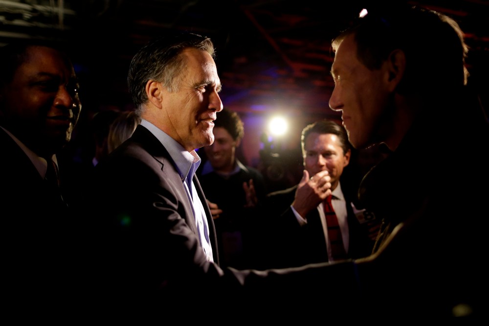 Mitt Romney, the former Republican presidential nominee, greets people after speaking during the Republican National Committee's winter meeting aboard the USS Midway Museum, Jan. 16, 2015, in San Diego. (Photo by Gregory Bull/AP)