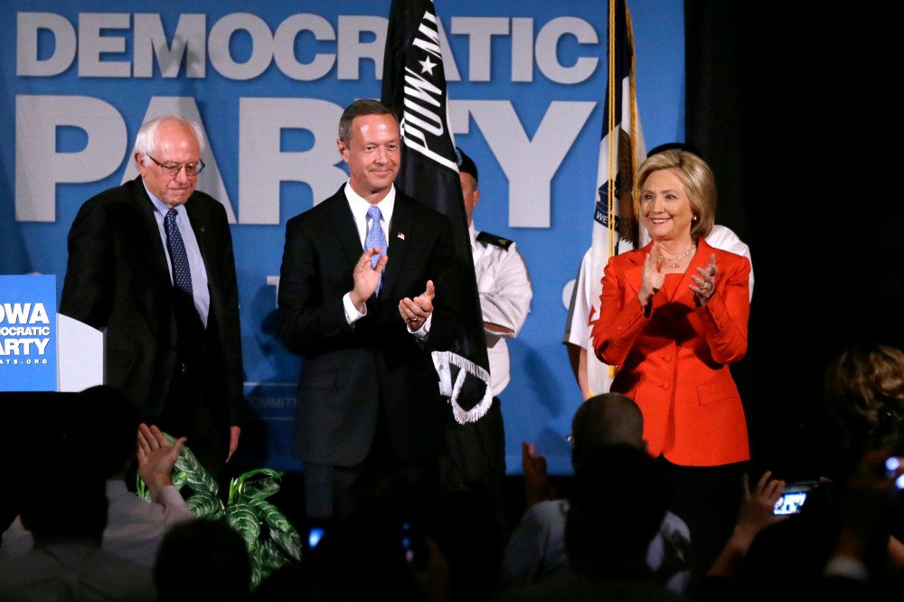Democratic presidential candidates, Bernie Sanders, Martin O'Malley and Hillary Rodham Clinton during the Iowa Democratic Party's Hall of Fame Dinner, July 17, 2015, in Cedar Rapids. (Photo by Charlie Neibergall/AP)