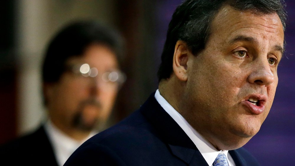 New Jersey Gov. Chris Christie stands in the gymnasium of Camden high school on Dec. 2, 2014, in Camden, N.J. (Mel Evans/AP)