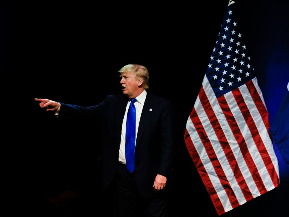 Republican presidential candidate Donald Trump points towards a demonstrator in the audience as he spoke at an election rally in Kansas City, Mo., March 12, 2016. (Photo by Nati Harnik/AP)