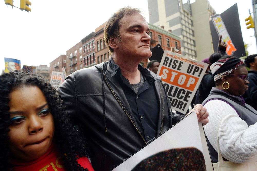 Director Quentin Tarantino participates in a rally to protest against police brutality, Oct. 24, 2015, in New York. Speakers at the protest said they want to bring justice for those who were killed by police. (Photo by Patrick Sison/AP)