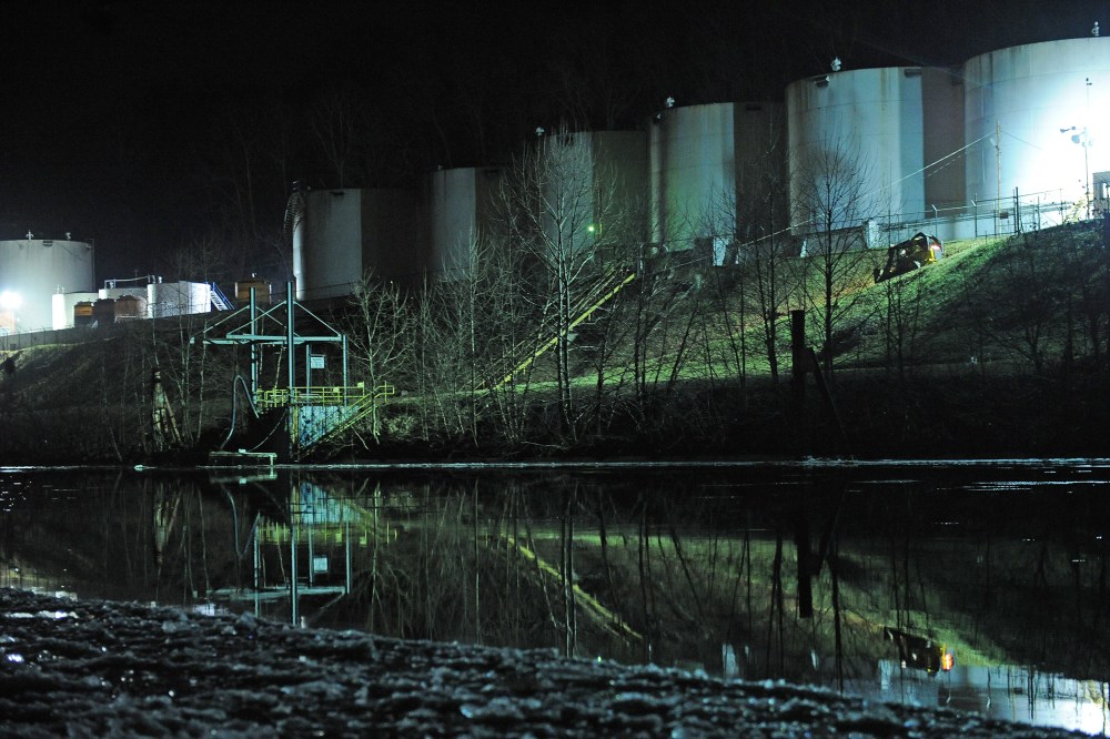 Crews clean up a chemical spill along the Elk River in Charleston, W.Va., Jan. 9, 2014.
