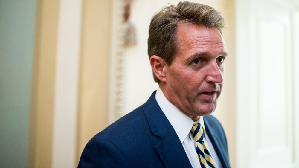 Sen. Jeff Flake, R-Ariz., stops to speak with a reporter as he arrives for the Senate Republicans' policy luncheon, May 12, 2015. (Photo By Bill Clark/CQ Roll Call/AP)