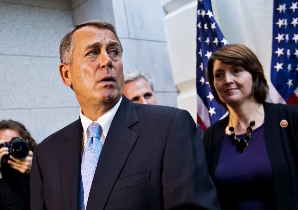 Speaker of the House John Boehner with House House GOP leaders, speaks with reporters following a Republican strategy session, at the Capitol on Oct. 15, 2013.