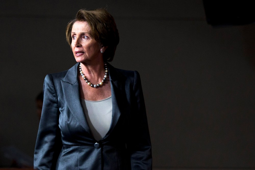 House Minority Leader Nancy Pelosi (D-Calif.) arrives for a news conference, Oct. 3, 2013, on Capitol Hill in Washington.