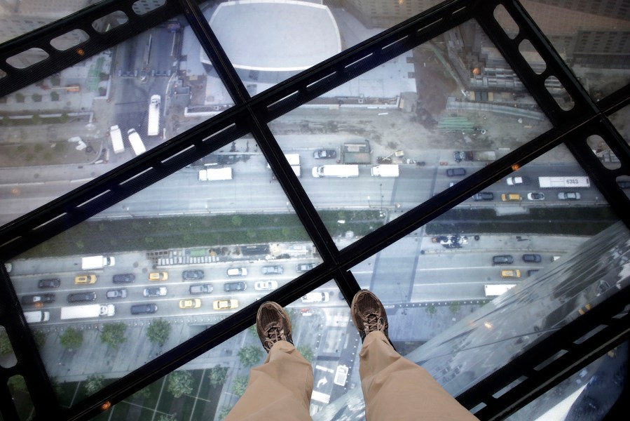 A view through the Sky Portal shows a live video view of the streets below from One World Observatory, May 20, 2015, in New York. (Photo by Mark Lennihan/AP)