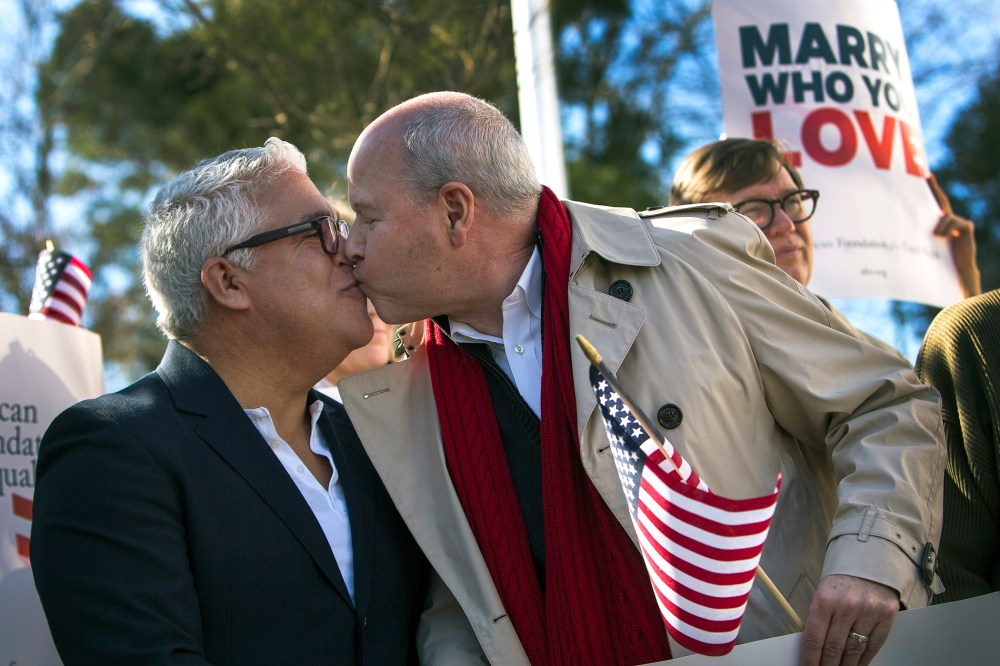 Robert Roman and Claus Ihlemann, of Virginia Beach, celebrate a ruling that declared Virginia's same-sex marriage ban unconstitutional on Feb. 14, 2014, in Norfolk, Va.