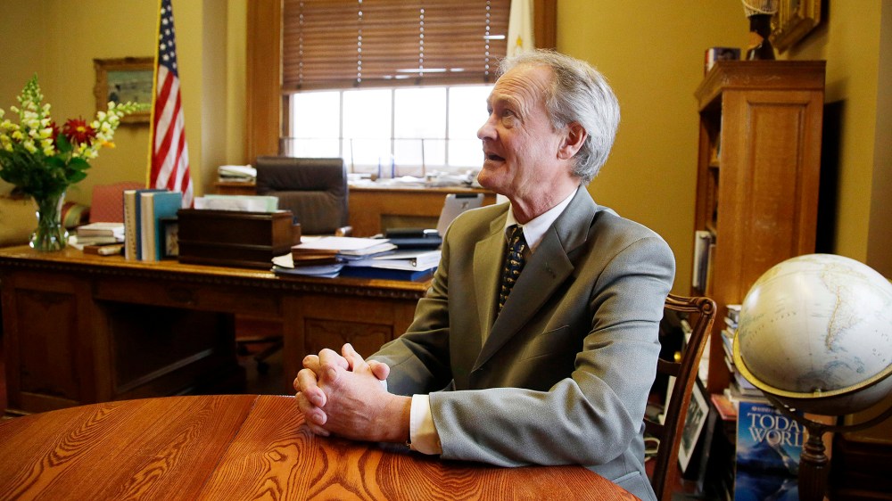 In this photo taken on Tuesday, Nov. 12, 2013, Rhode Island Gov. Lincoln Chafee talks with The Associated Press during an interview at his Statehouse office in Providence, RI. (Photo by Stephan Savoia/AP)