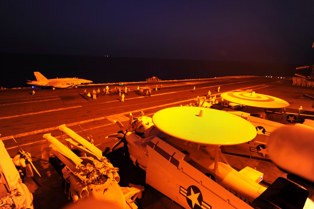 In this file photo released by the U.S. Navy on Tuesday, Sept. 23, 2014, A-18C Hornet prepares to launch from the flight deck to conduct strike missions against Islamic State group targets, in the Arabian Gulf. (Robert Burck/U.S. Navy-File/AP)