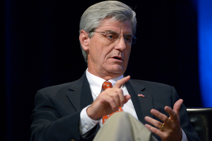 Mississippi Gov. Phil Bryant answers a question during a panel discussion in Orlando, Fla., Aug. 22, 2013.