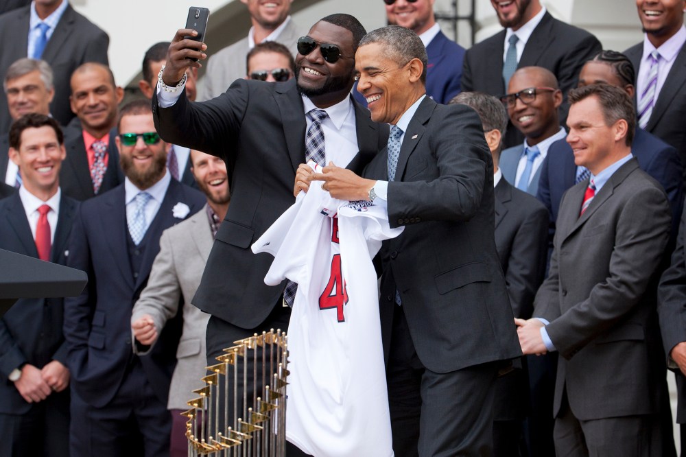 Boston Red Sox player David Ortiz, left, takes a selfie with President Barack Obama, April 1, 2014 on the South Lawn of the White House in Washington, where the president honored the Boston Red Sox on their 2013 World Series championship.