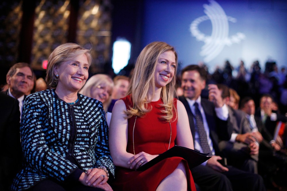 Former Secretary of State Hillary Rodham Clinton, left, and her daughter Chelsea Clinton, center, at the  Clinton Global Initiative in New York, Sept. 24, 2013.