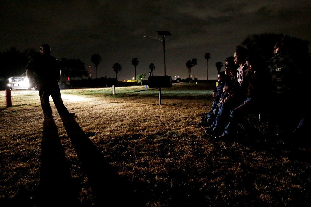 A group of immigrants from Honduras and El Salvador, who crossed the U.S.-Mexico border illegally, are stopped in Granjeno, Texas, on June 25, 2014.