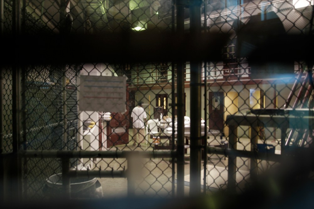 A prisoner walks through a communal pod inside an area of the Guantanamo Bay detention center known as Camp 6.