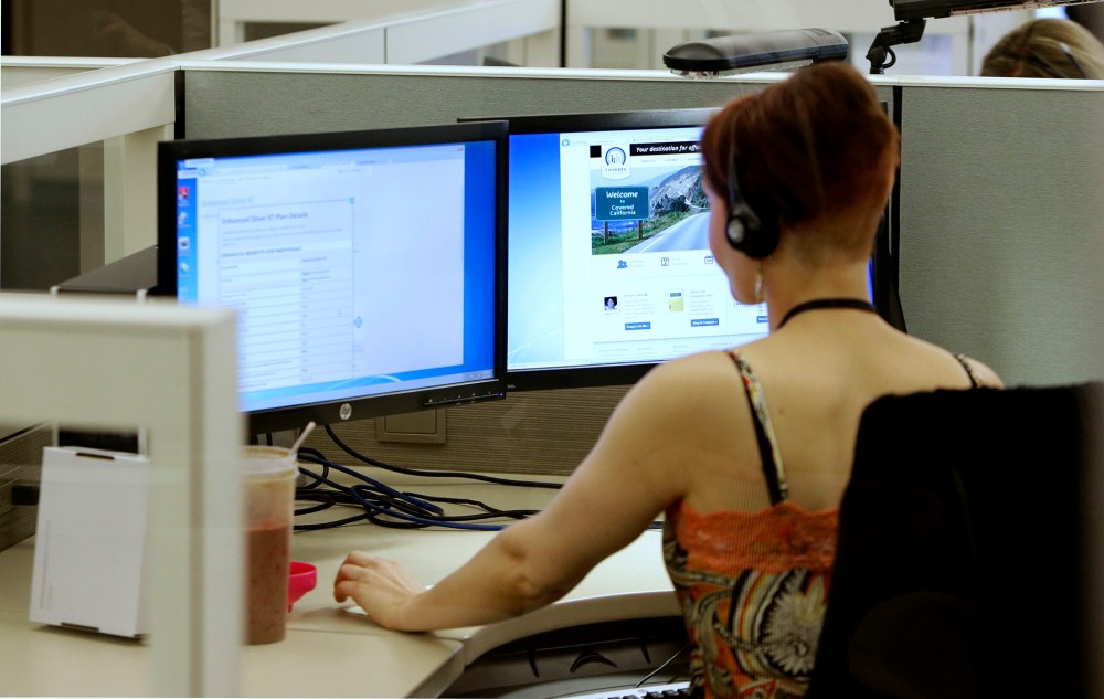 Gina Macaluso, an employee of  Covered California, the state's new health care exchange, provides health insurance at the  newly opened call center in Rancho Cordova, Calif., Tuesday, Oct. 1, 2013.