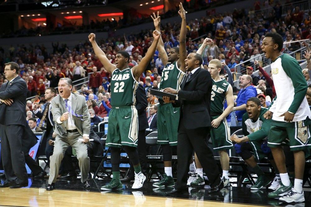 The UAB bench cheers after guard Robert Brown hit a 3-point basket in the closing seconds of the second half against Iowa State in the second round of the NCAA college basketball tournament in Louisville, Ky., March 19, 2015.(Photo by David Stephenson/AP)