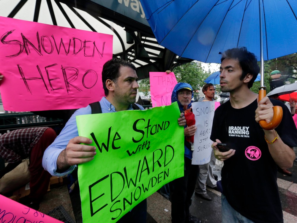 Demonstrators hold signs supporting Edward Snowden in New York's Union Square Park, Monday, June 10, 2013. Snowden, who says he worked as a contractor at the National Security Agency and the CIA, gave classified documents to reporters, making public...