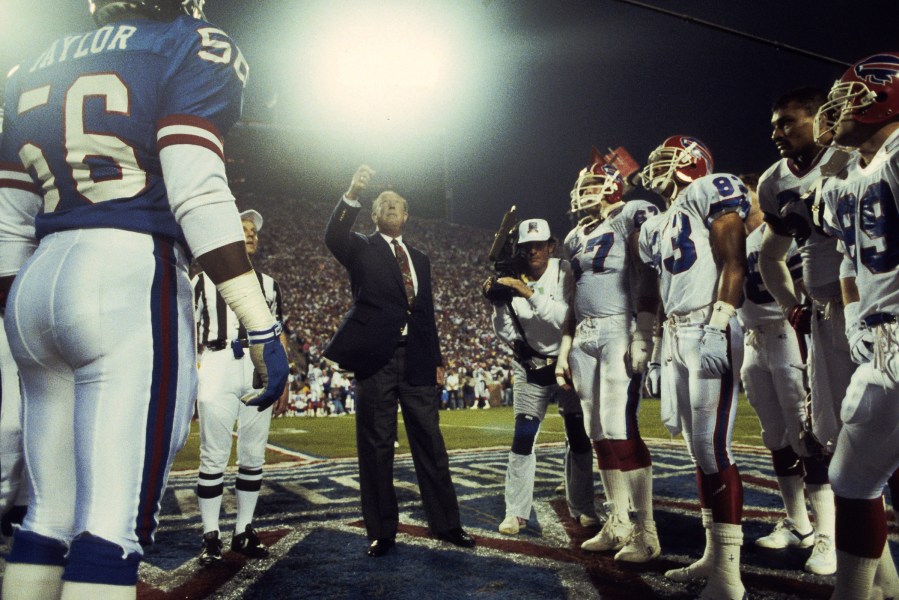 NFL Commissioner Pete Rozelle tosses the coin before a 20-19 New York Giants win over the Buffalo Bills in Super Bowl XXV on January 27, 1991 at Tampa Stadium in Tampa Bay, Fla.