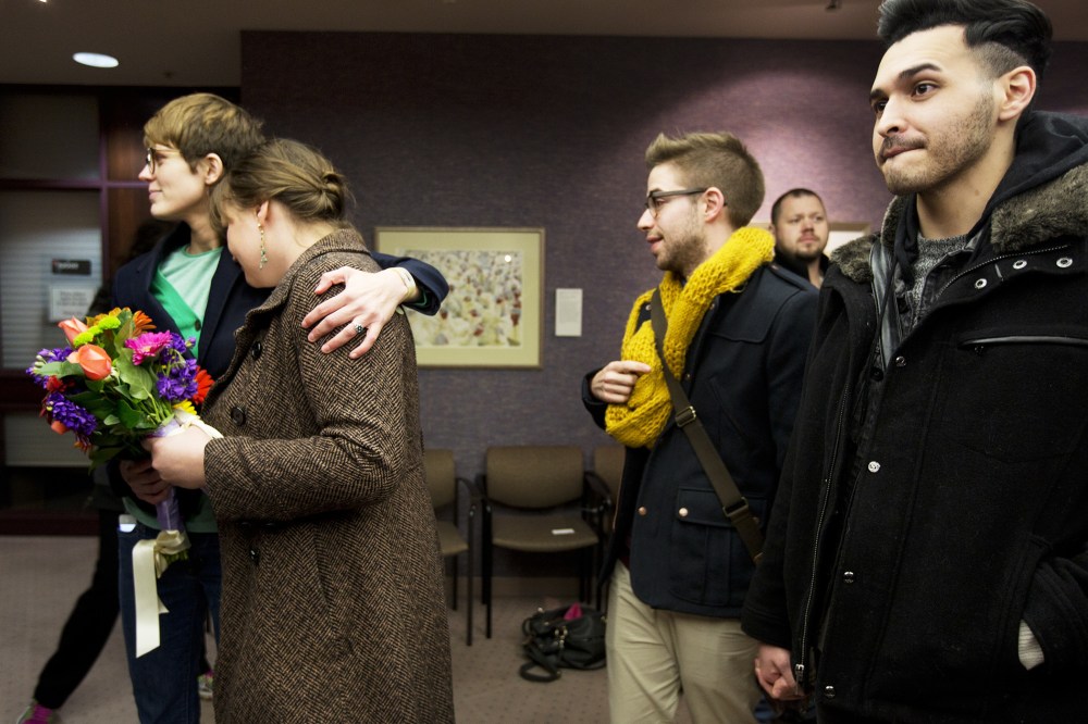 Same-sex couples wait in line to get a marriage license at the Salt Lake County Clerk's Office, Dec. 20, 2013.