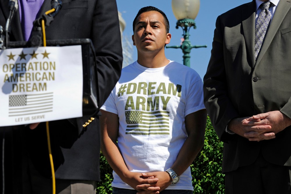 DREAM Action Coalition Co-Director Cesar Vargas, center, participates in a news conference on Capitol Hill in Washington, D.C., July 25, 2014. (Photo by AP)