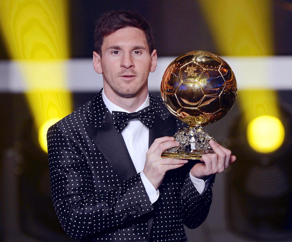 FC Barcelona's Argentinian striker Lionel Messi poses with the trophy after being awarded the FIFA Men's World Player of the Year during the FIFA Ballon d'Or Gala 2012 held at the Kongresshaus in Zurich, Switzerland, Monday,  Jan 7, 2013. Messi was...