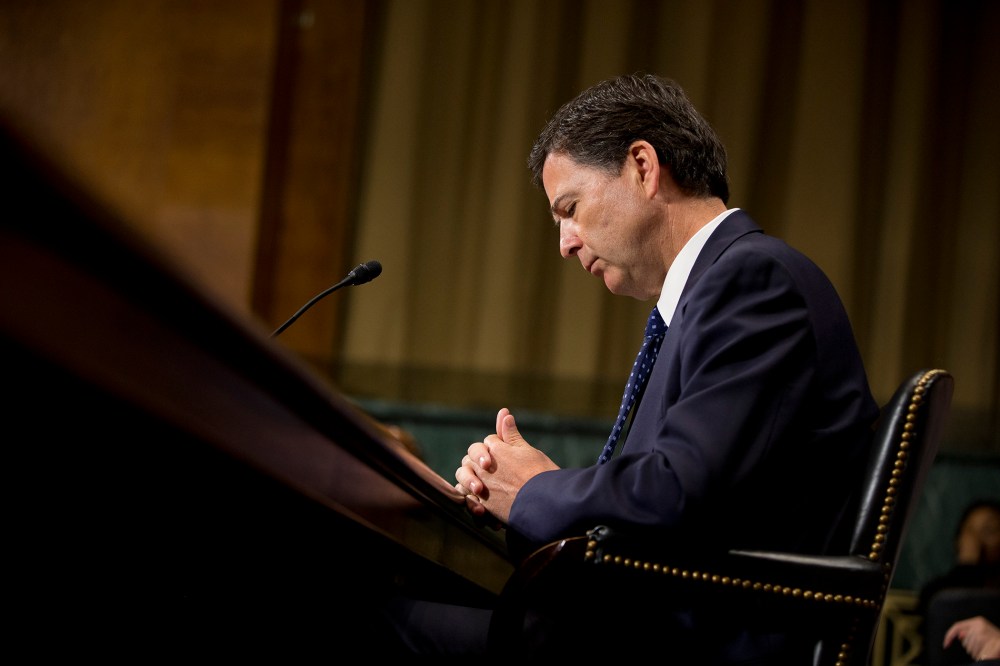 FBI Director then-nominee James Comey pauses as he testifies on Capitol Hill in Washington, July 9, 2013, before the Senate Judiciary Committee hearing on his nomination. (Photo by Evan Vucci/AP)