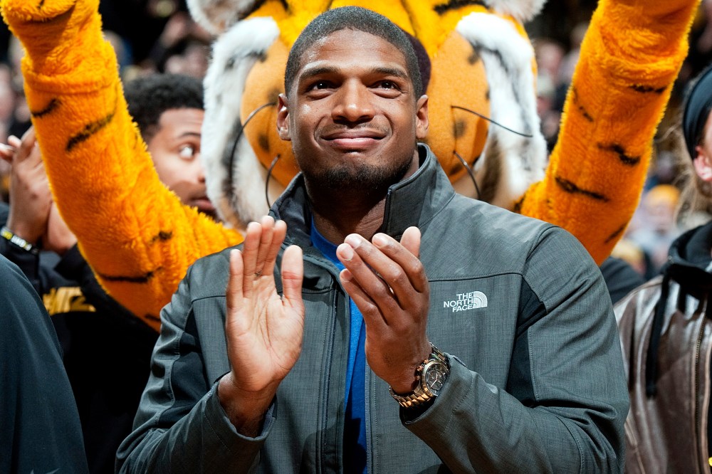 Missouri's All-American defensive end Michael Sam claps during the Cotton Bowl trophy presentation, Feb. 15, 2014, in Columbia, Mo.