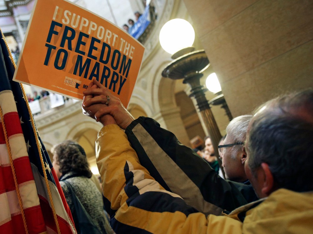 File Photo: In this Feb. 14, 2013 file photo supporters of gay marriage call for Minnesota lawmakers to legalize gay marriage at the State Capitol in St. Paul, Minn. Minnesota has a state House vote on gay marriage  Thursday, May 9, 2013, and...