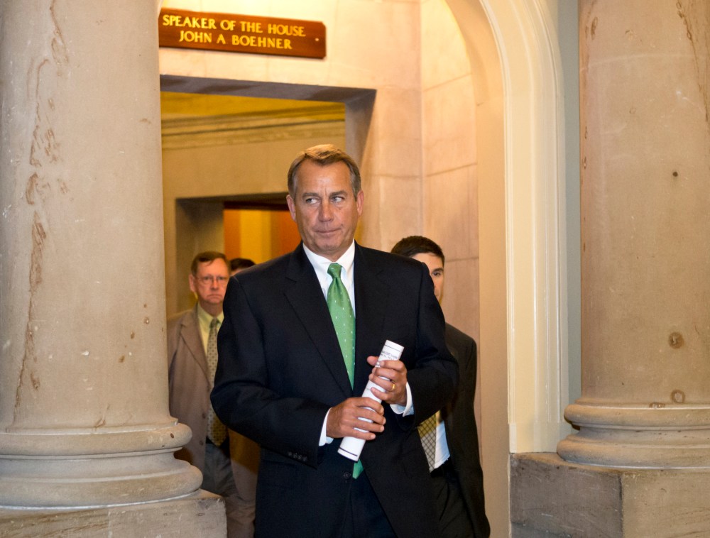 House Speaker Boehner leaves his office and walks to the House floor. (AP Photo/J. Scott Applewhite)