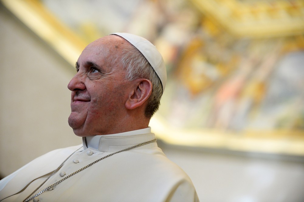 Pope Francis smiles as he meets with Cyprus President Nicos Anastasiades during a private audience in the pontiff's studio, at the Vatican,  Feb. 15, 2014.