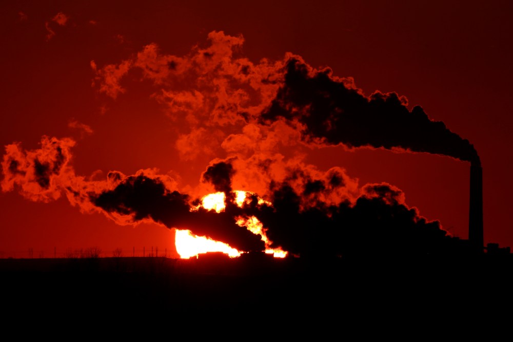 In this March 8, 2014 file photo steam a coal-fired power plant is silhouetted against the setting sun near St. Marys, Kan.