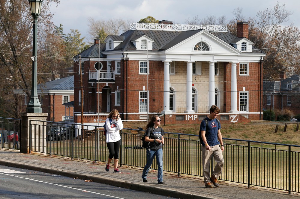 University of Virginia students walk to campus past the Phi Kappa Psi fraternity house at the University of Virginia in Charlottesville, Va. on Nov. 24, 2014. (Steve Helber/AP)