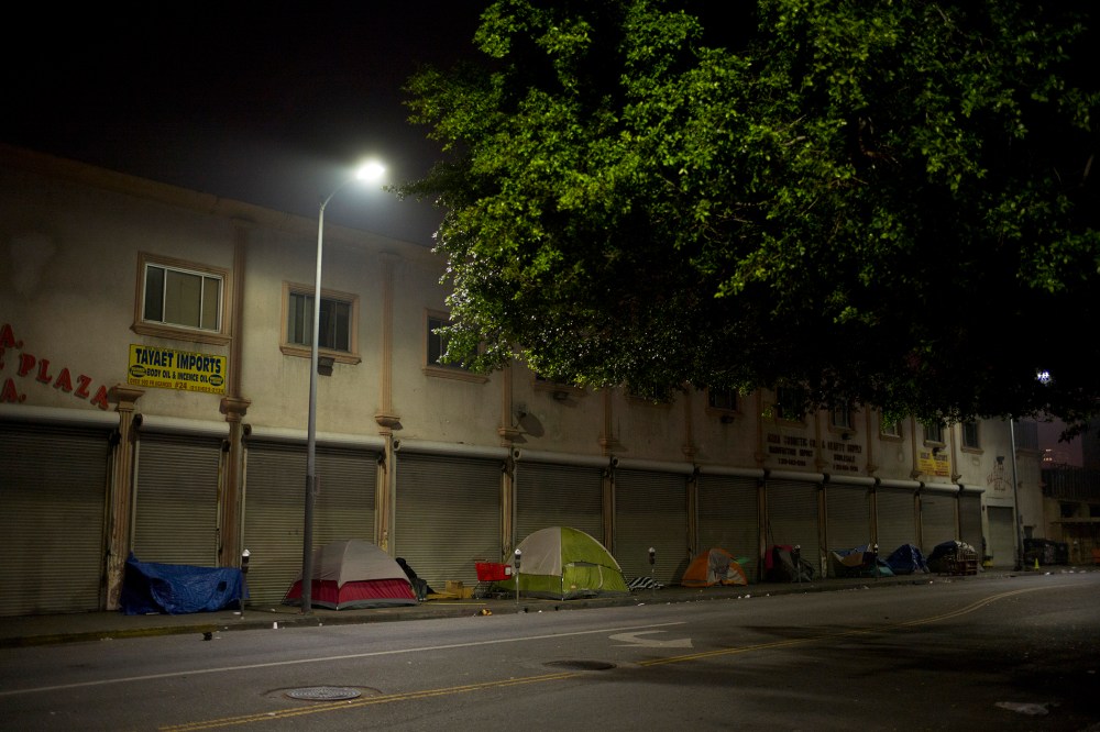 Tents set up by homeless people sit in front of a building on Skid Row, Feb. 4, 2015, in Los Angeles, Calif. (Photo by Jae C. Hong/AP)