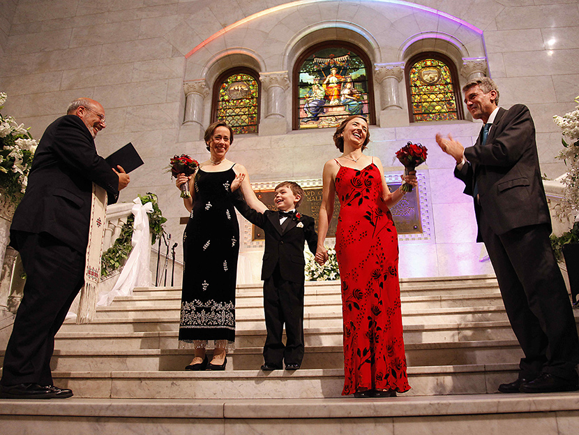 Cathy ten Broeke and Margaret Miles hold their son Louie's hand after walking the steps at Minneapolis City Hall to be married by Reverend James Gertmenian, left, and Mayor R.T. Rybak at the Minneapolis Freedom to Marry Celebration and Weddings,...